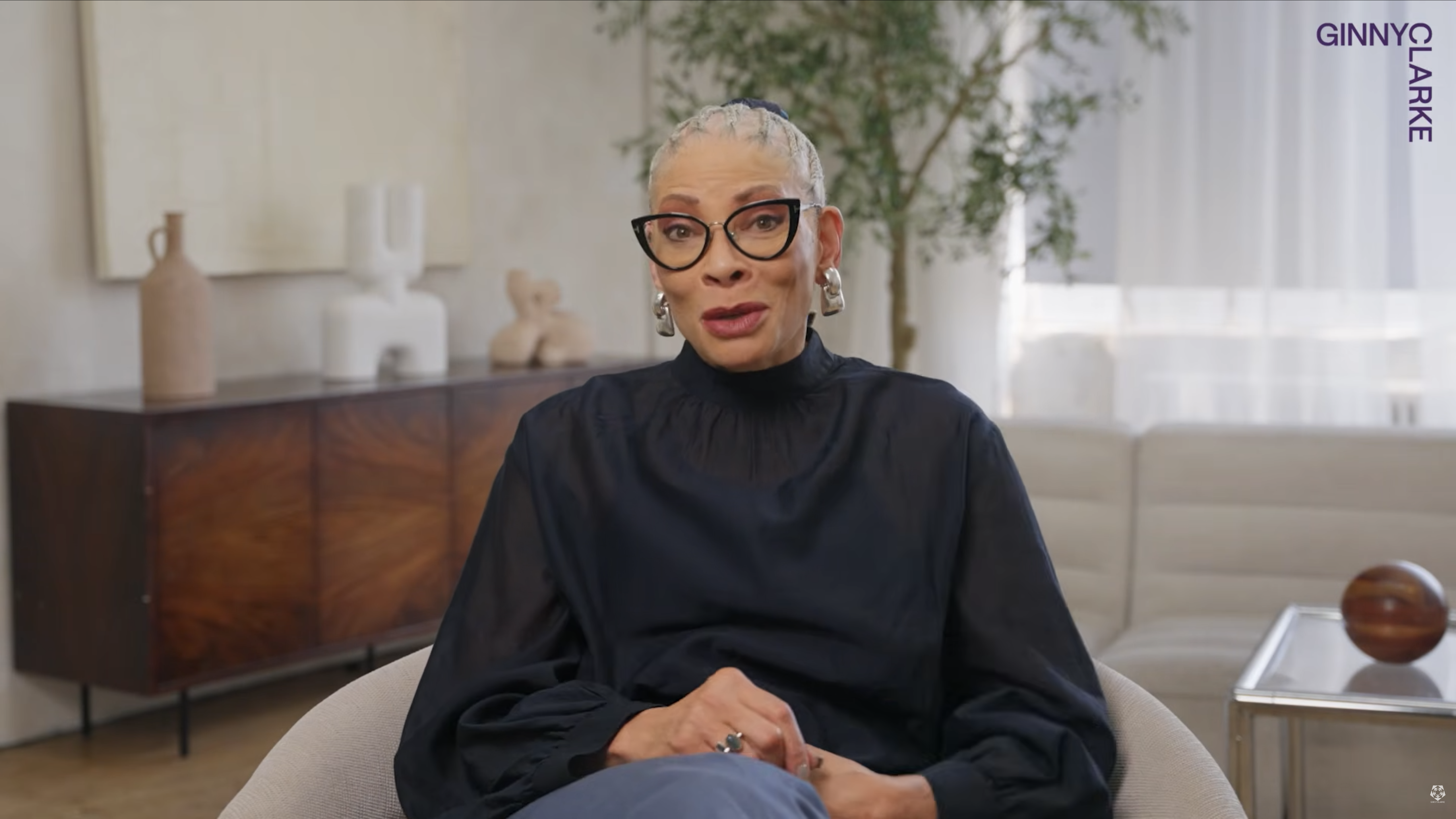 Ginny Clarke speaking in a YouTube video