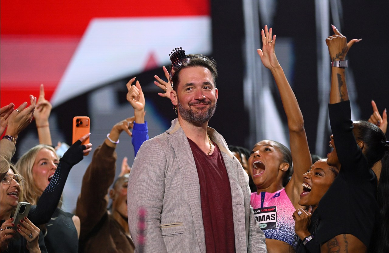 Alexis Ohanian wearing a Tiffany & Co crown on stage at ATHLOS London 2026 at StoneX Stadium in Barnet, England