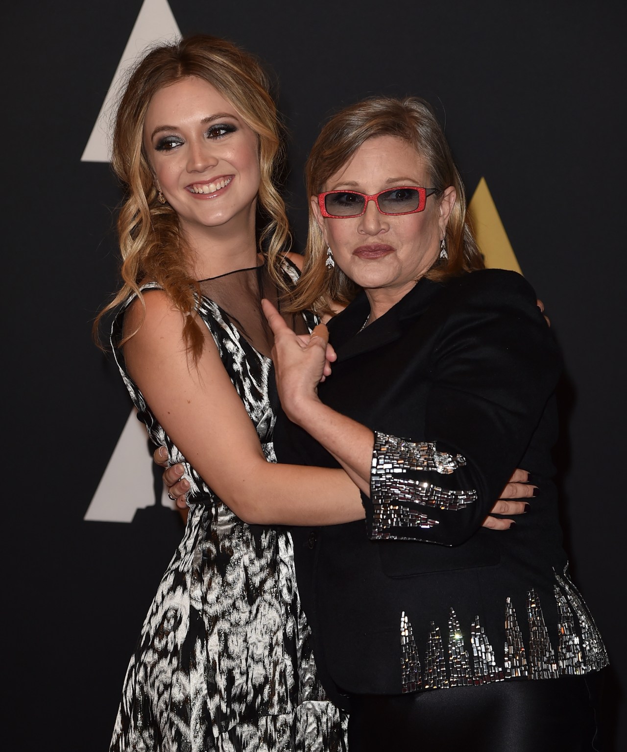 Carrie Fisher and Billie Lourd smiling together at the Academy's Governors Awards in Hollywood, 2015