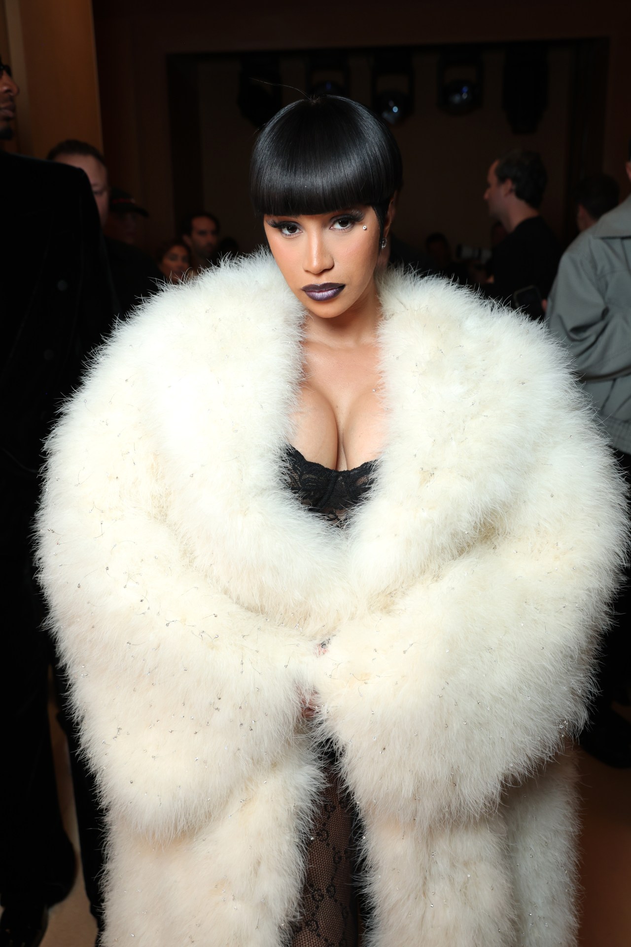 Cardi B seated in the front row at the Gucci womenswear show during Milan Fashion Week