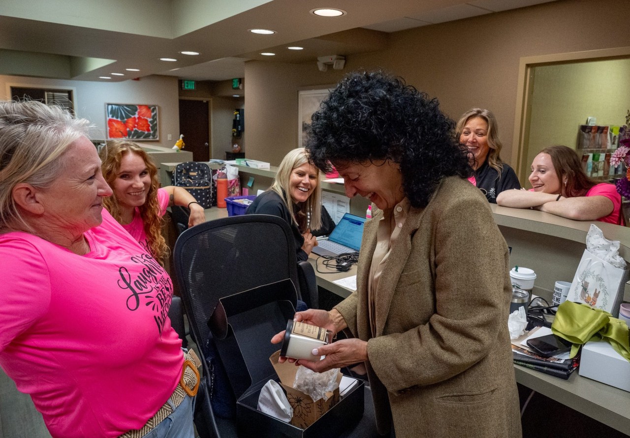 Dr. Cecilia Ellis surprised by colleagues with gifts at OBGYN Associates of Akron on her retirement day