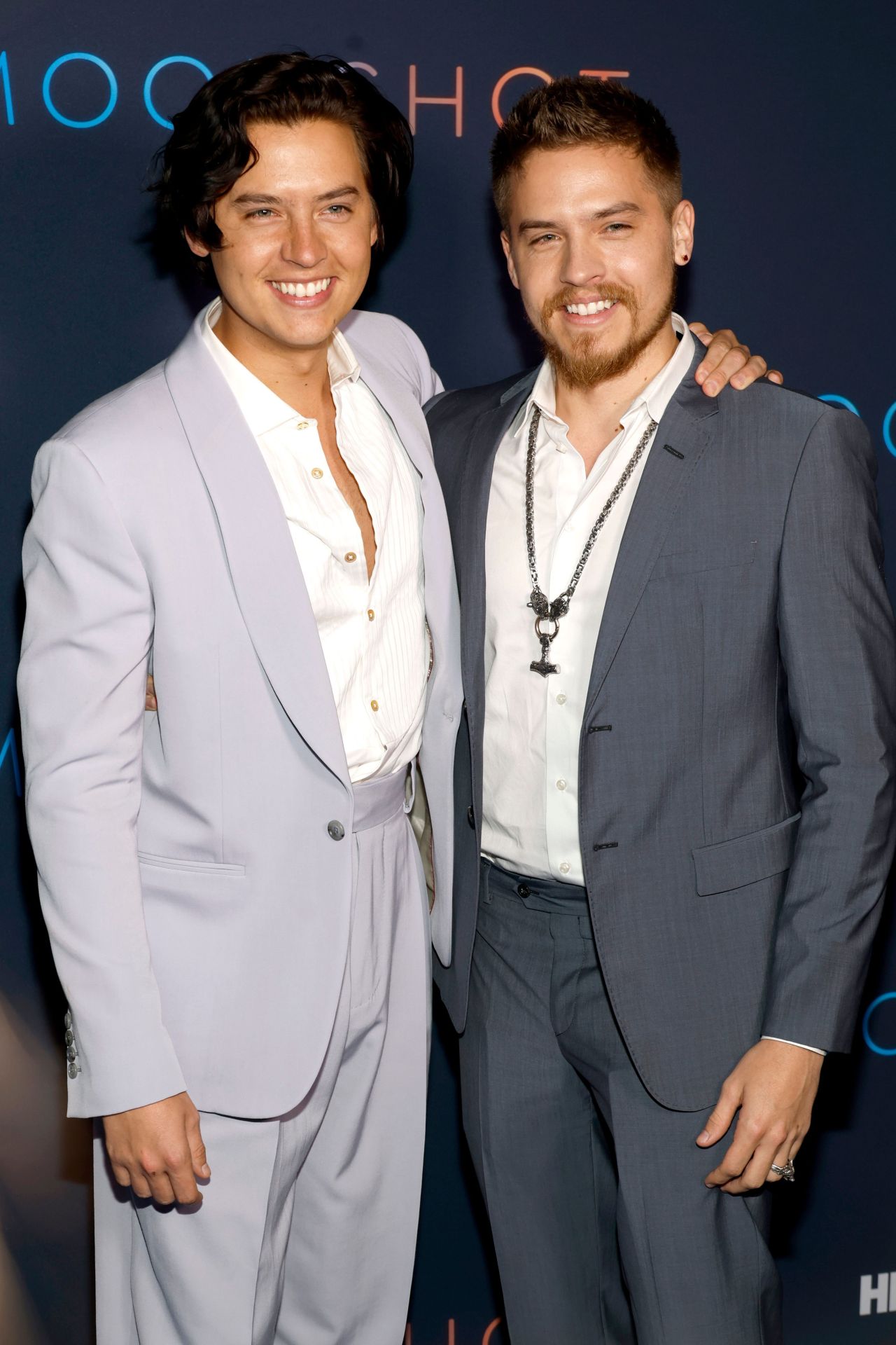Cole Sprouse and Dylan Sprouse standing together at the HBO Max Moonshot screening in West Hollywood