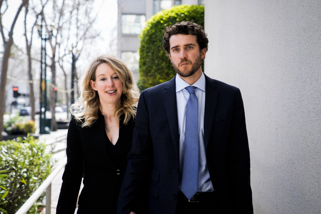 Elizabeth Holmes and Billy Evans walking outside a courthouse in San Jose, California