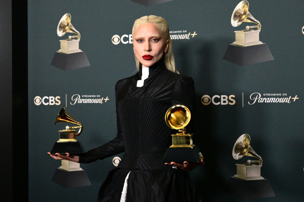 Lady Gaga holding two Grammy Awards in the press room at the 68th Annual Grammy Awards at Crypto.com Arena in Los Angeles