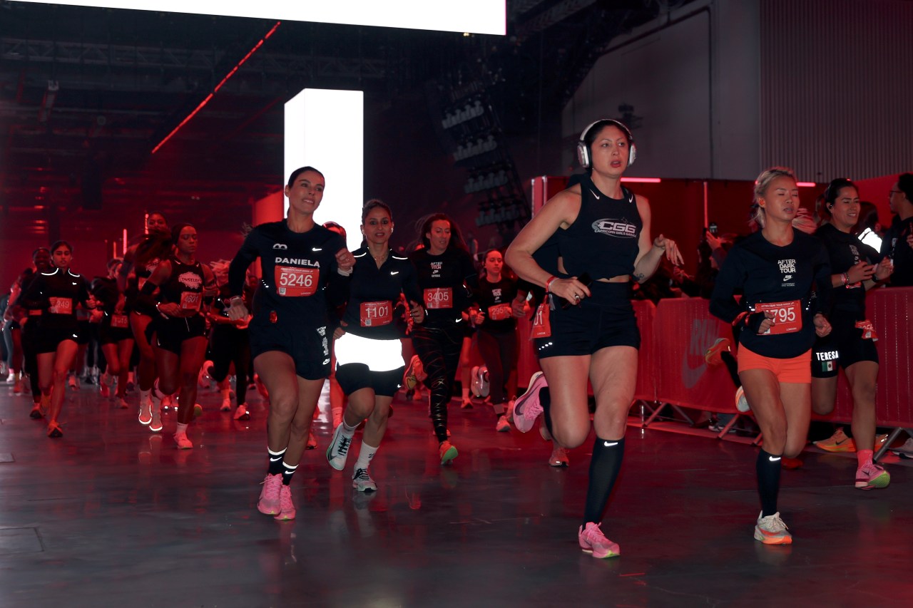 Runners competing in the Nike After Dark Tour race at ExCel London