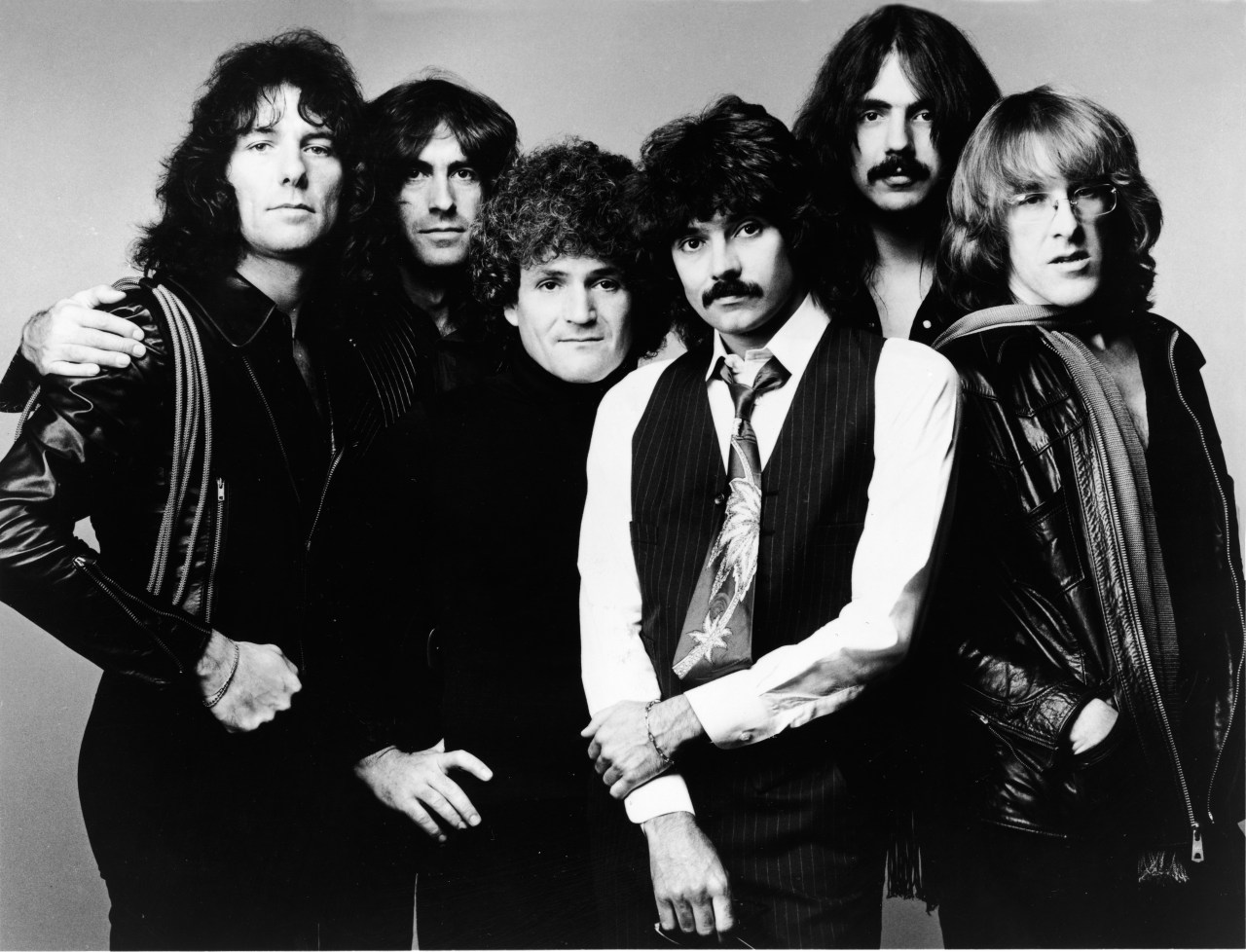 Jefferson Starship band members posing together in a 1970s promotional studio portrait
