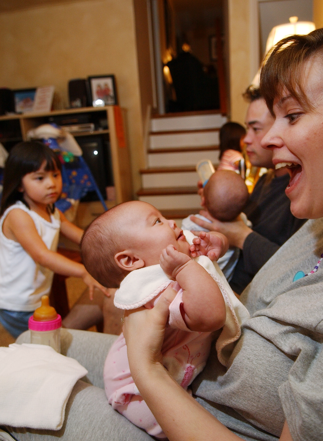 9/28/2004 Photo by Krissy Krummenacker 200402657 Kate I. Gosselin reacts to smiling daughter Hannah while husband Jonathan K. Gosselin feeds son Collin T. as their daughter Madelyn K., left, looks on,